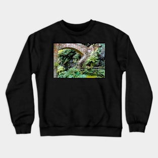 A stone arch decorates the garden Crewneck Sweatshirt